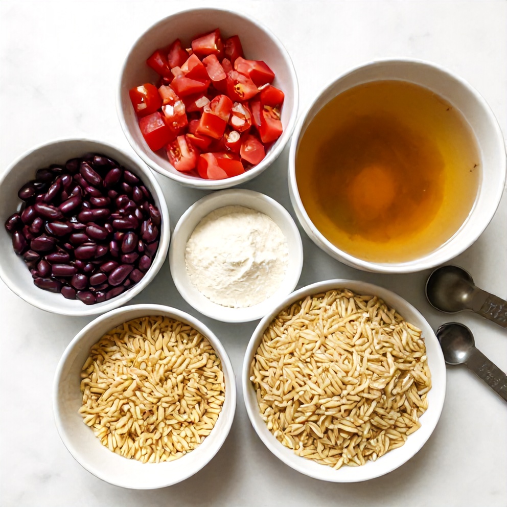 Orzo, beans, tomatoes, and Mediterranean spices laid out for the one-pot dinner