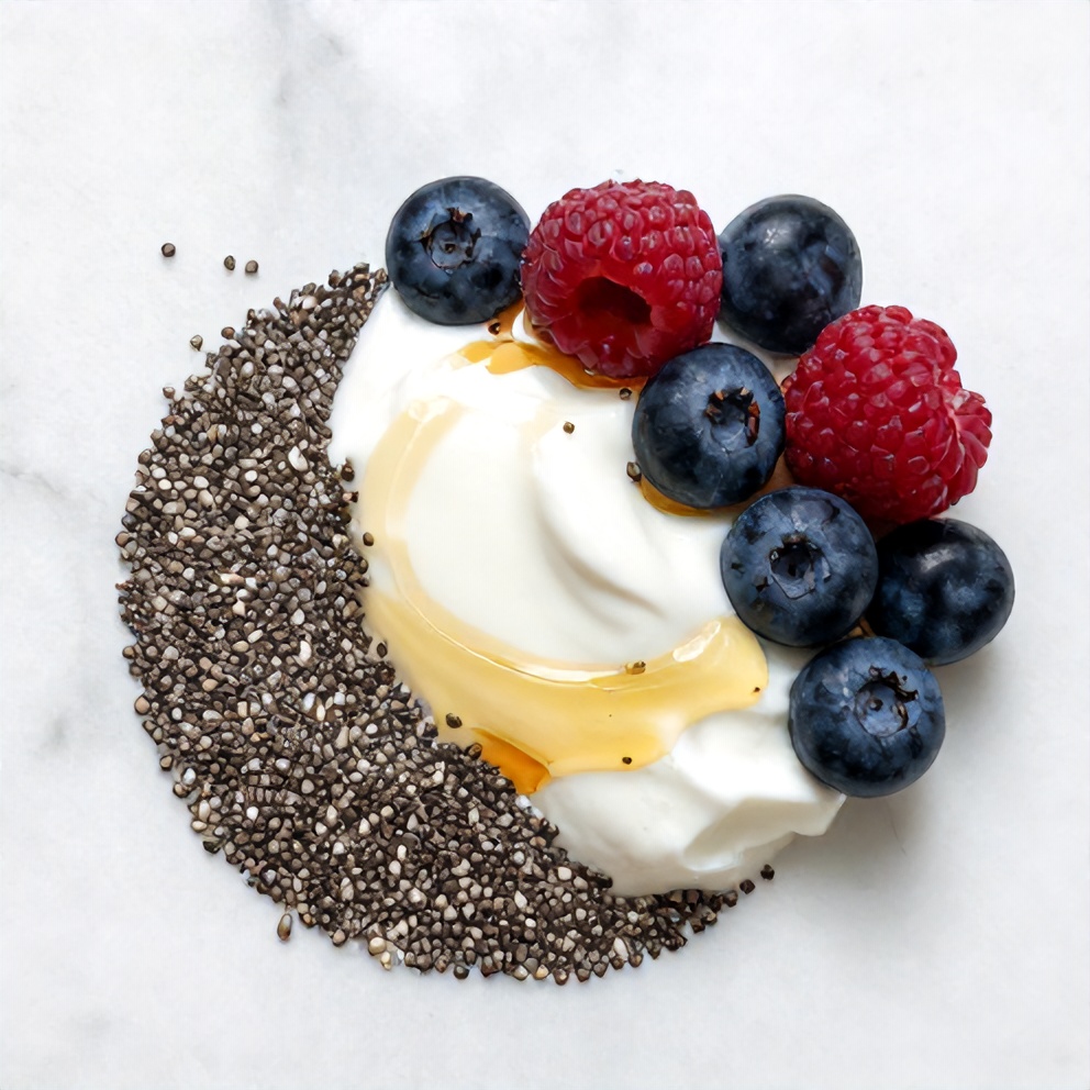 Greek yogurt, chia seeds, honey, vanilla extract, milk, and berries arranged on a wooden surface